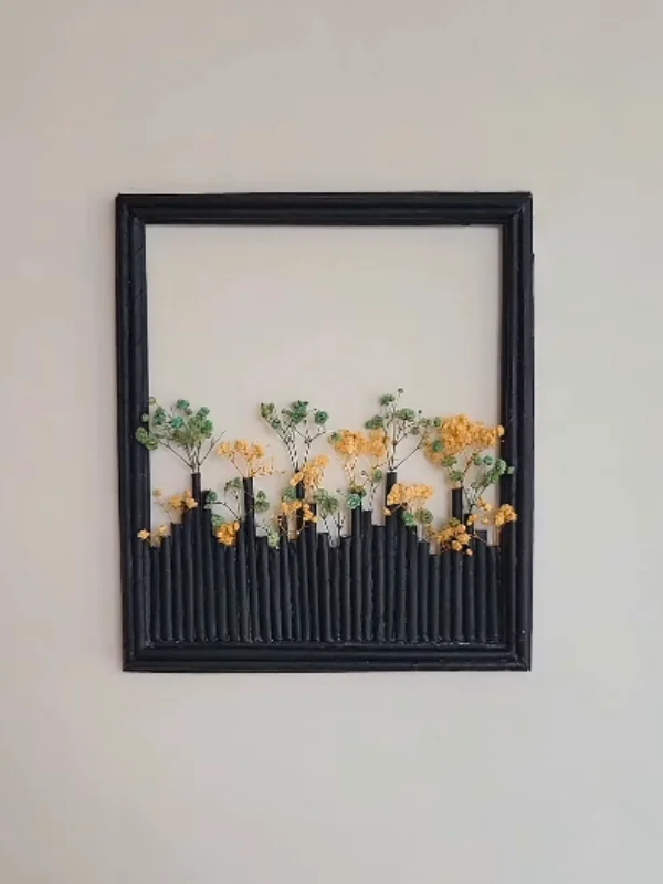 Rolled Newspaper Skyline Inside an Old Picture Frame