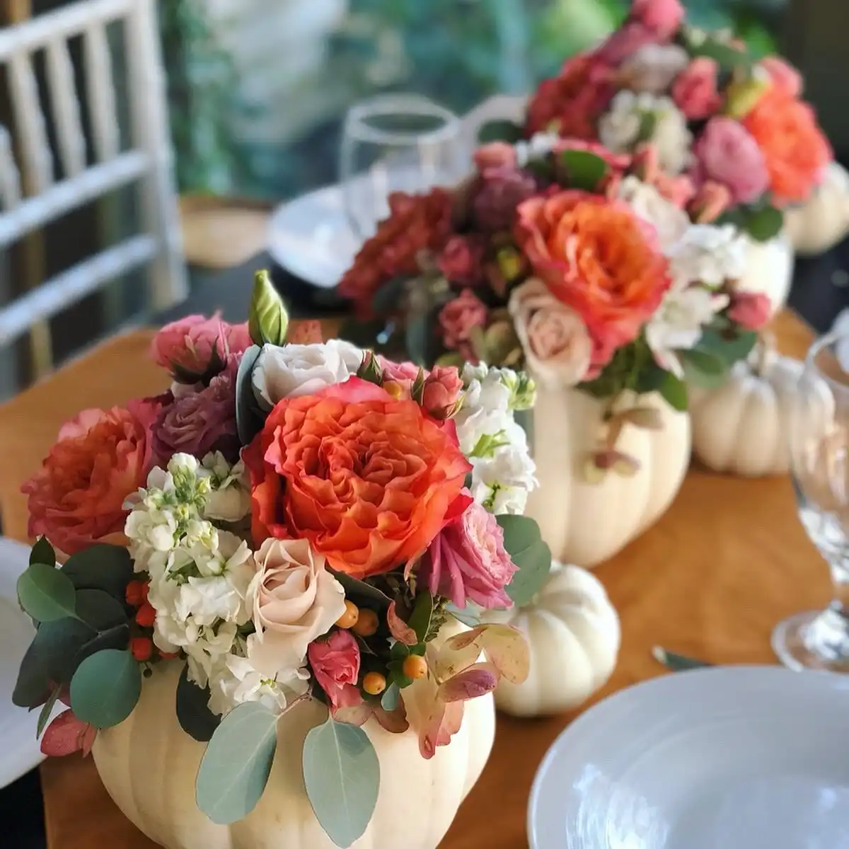 White Pumpkins Hollowed Into Flower Vases