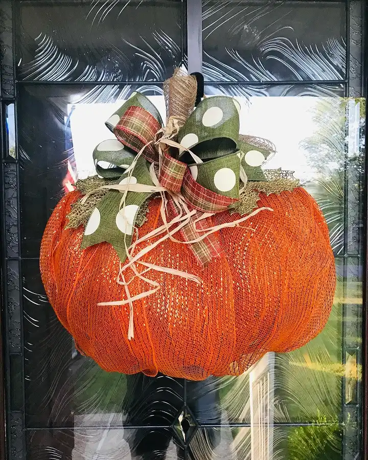 Deco Mesh Pumpkin Door Hanger With a Double Ribbon Bow