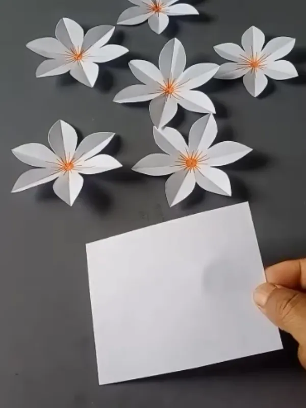 18 Craft Ideas For Paper Flowers You Can Make in Minutes 6 Star Petal Flowers With Thread Centers