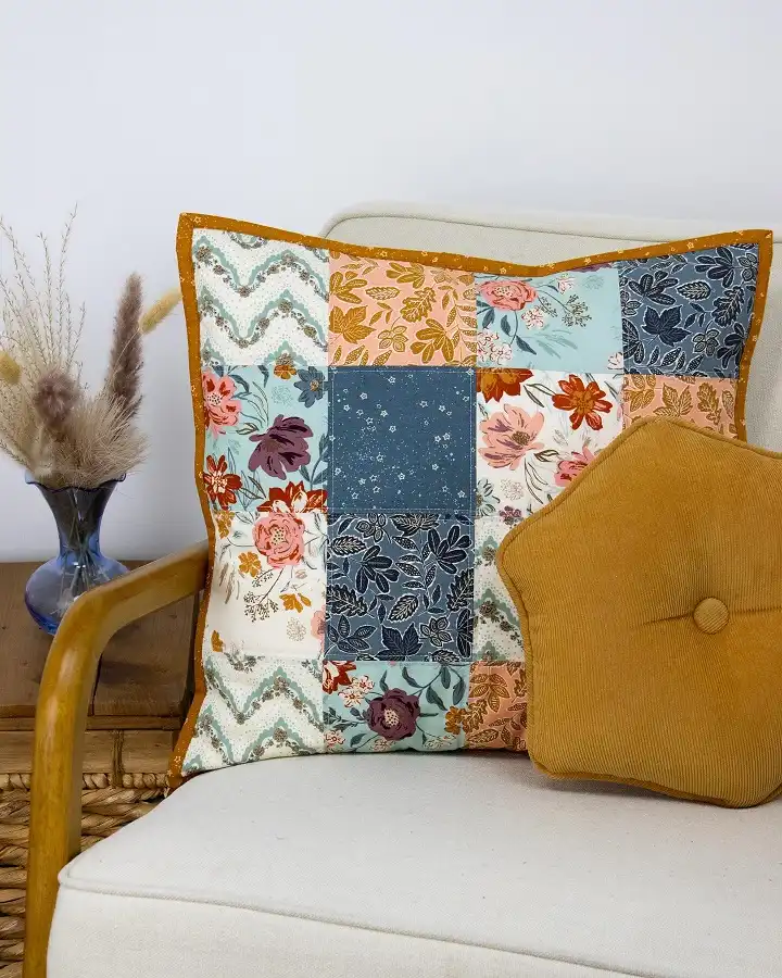 Long cream pillow, 10 mismatched pumpkins, wicker bench