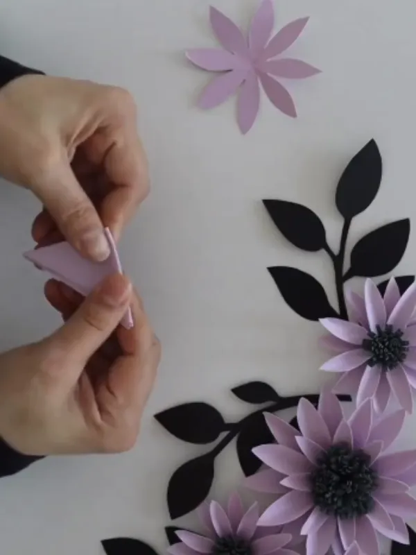 18 Craft Ideas For Paper Flowers You Can Make in Minutes 8 Wall Cluster With Black Leaf Silhouettes