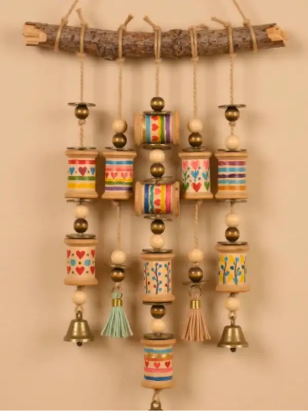 Painted Spool Wind Chime That Turns a Branch Into Something Worth Hanging
