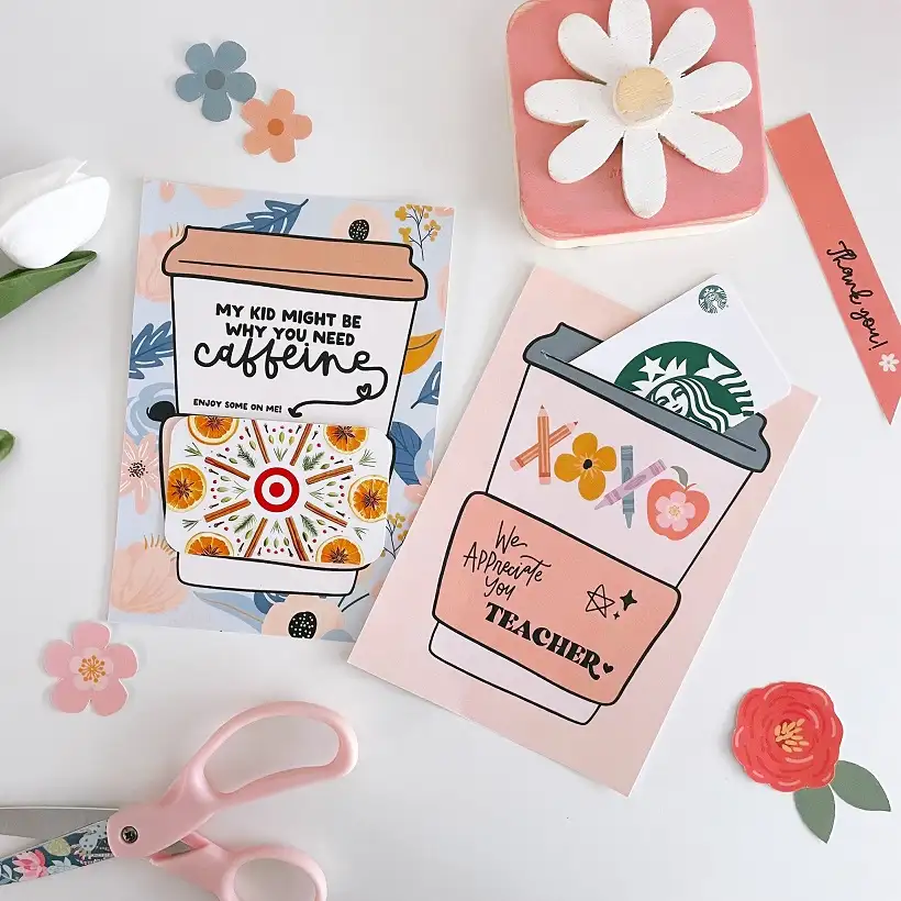 15 Easy Paper Crafts DIY for Teachers: Quick Classroom Wins 5 Two paper coffee cup cards with front pockets holding gift cards, beside pink scissors and paper flowers.