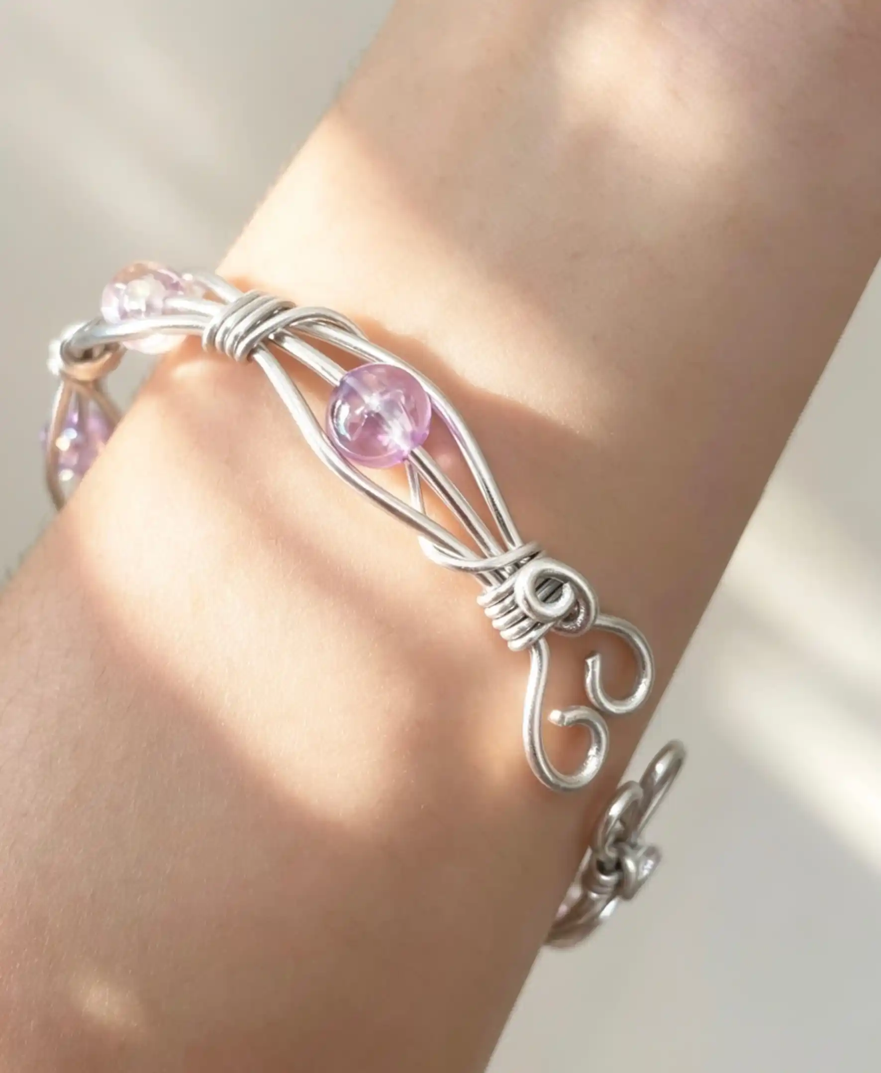 7. Silver Wire Cages Around Soft Lavender Beads
