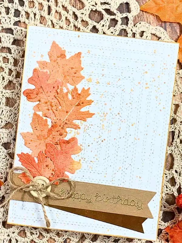 17 Cozy Fall Themed DIY Birthday Card Ideas That Feel Like a Warm Hug 8 7. Cascading Autumn Leaves Card With a Twine Tied Birthday Banner