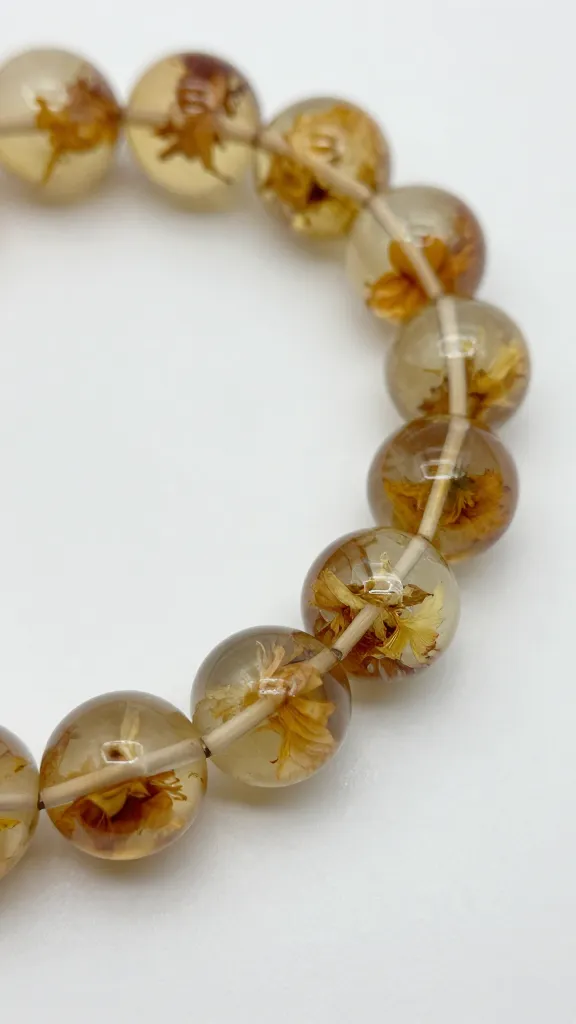 How to Make Resin Bracelets at Home 4 Close-up of dried flower inclusion inside resin bracelet