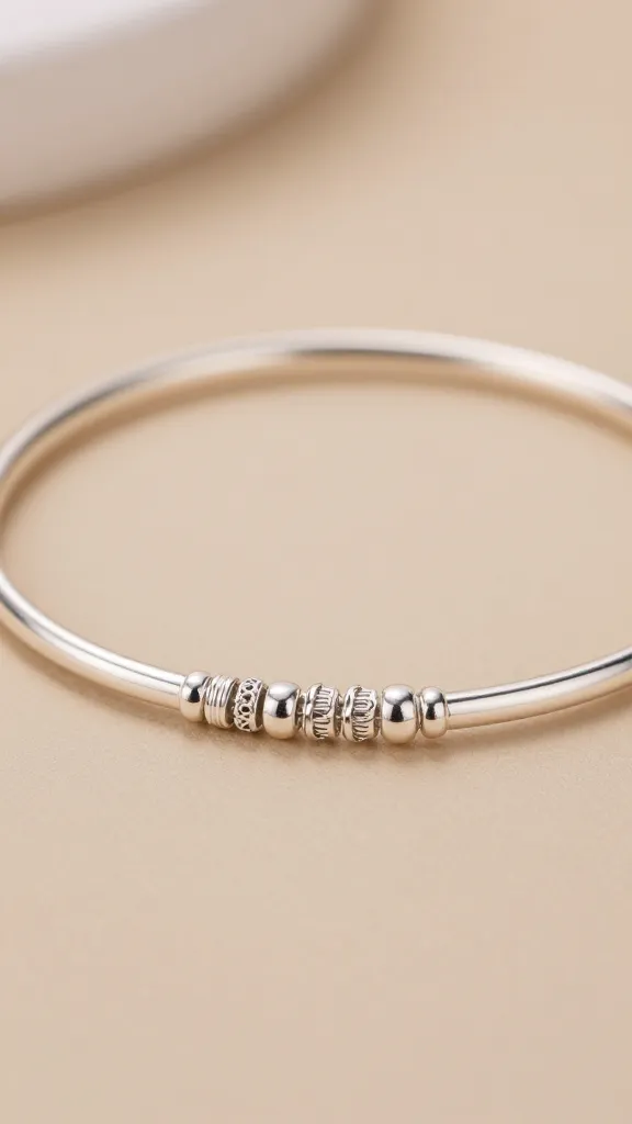 How to Stack Bracelets Without It Looking Messy 3 Closeup of a delicate silver bracelet stack, focus on texture detail