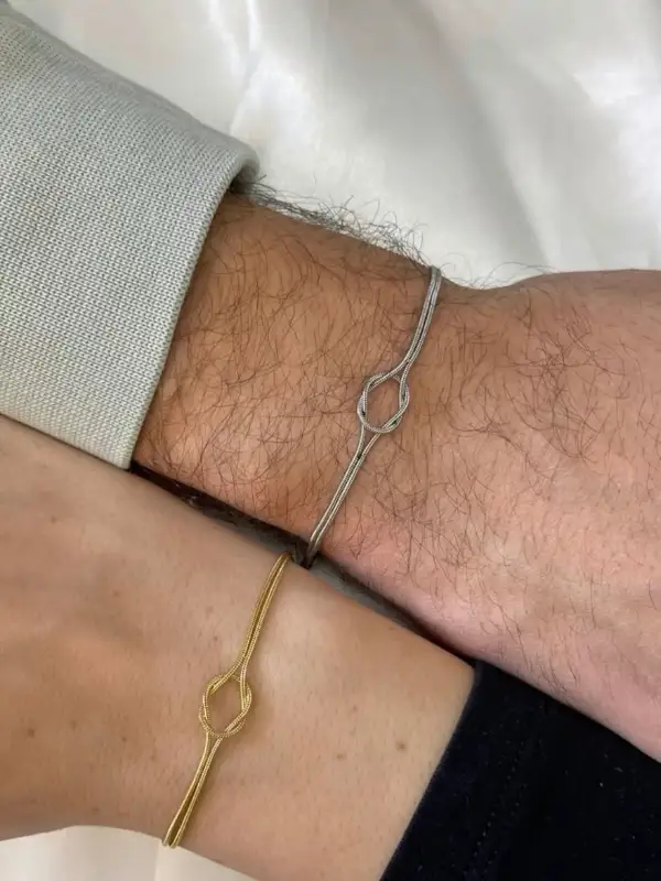 Slim Silver Knot Bracelet Paired With Her Gold One
