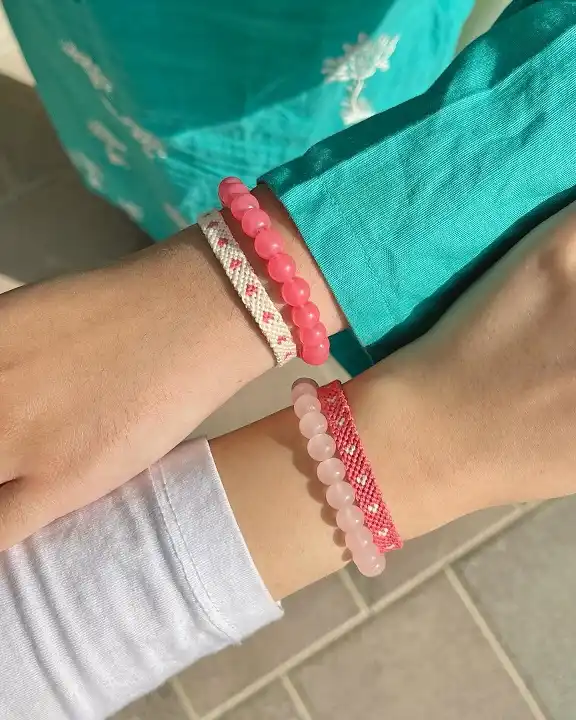 20 Cute Friendship Bracelet Ideas (Beaded, Woven, and Charm Styles) 14 Heart Pattern and Pink Bead Bracelet Duo