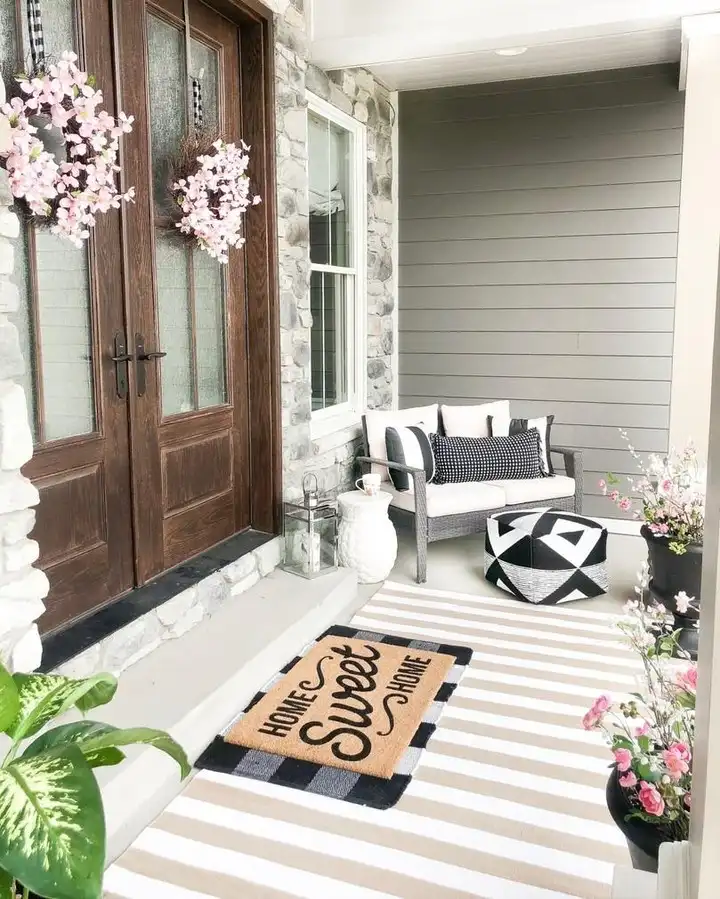 16 Minimalist Front Porch Ideas That Look Expensive on a Budget 3 Striped Rug and a Small Loveseat Corner