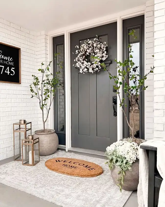 16 Minimalist Front Porch Ideas That Look Expensive on a Budget 5 Tall, Airy Trees for a Soft Neutral Entry