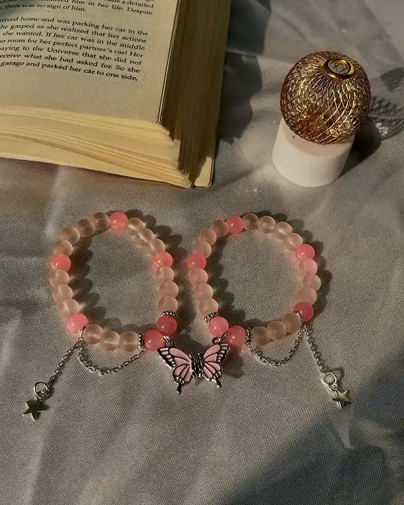 20 Cute Friendship Bracelet Ideas (Beaded, Woven, and Charm Styles) 2 Frosted Pink Beaded Set with Butterfly Charm
