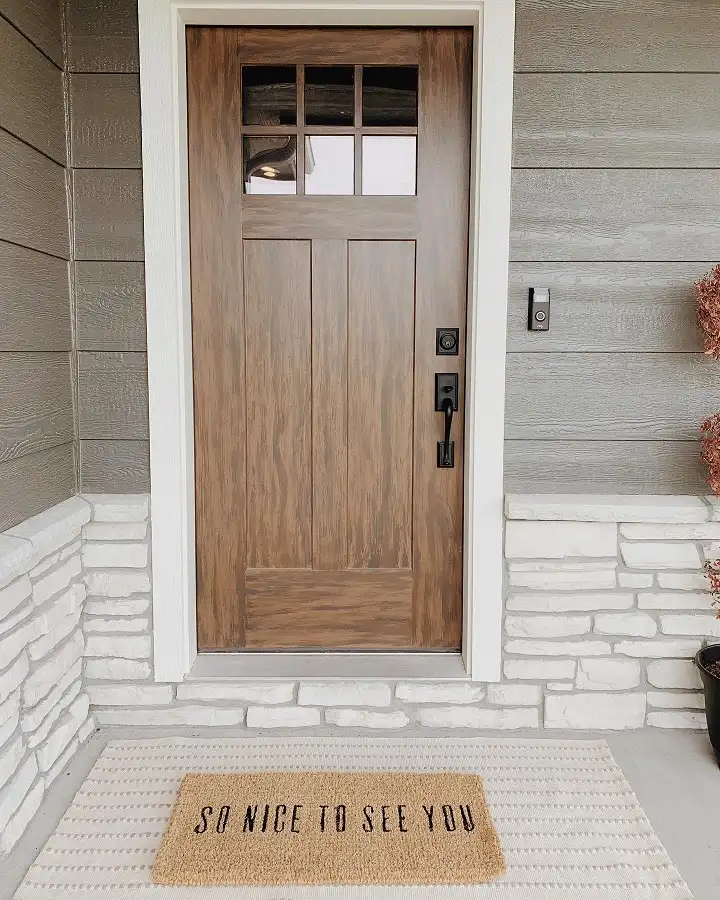 16 Minimalist Front Porch Ideas That Look Expensive on a Budget 8 Let the Front Door and a Layered Mat Do All the Work