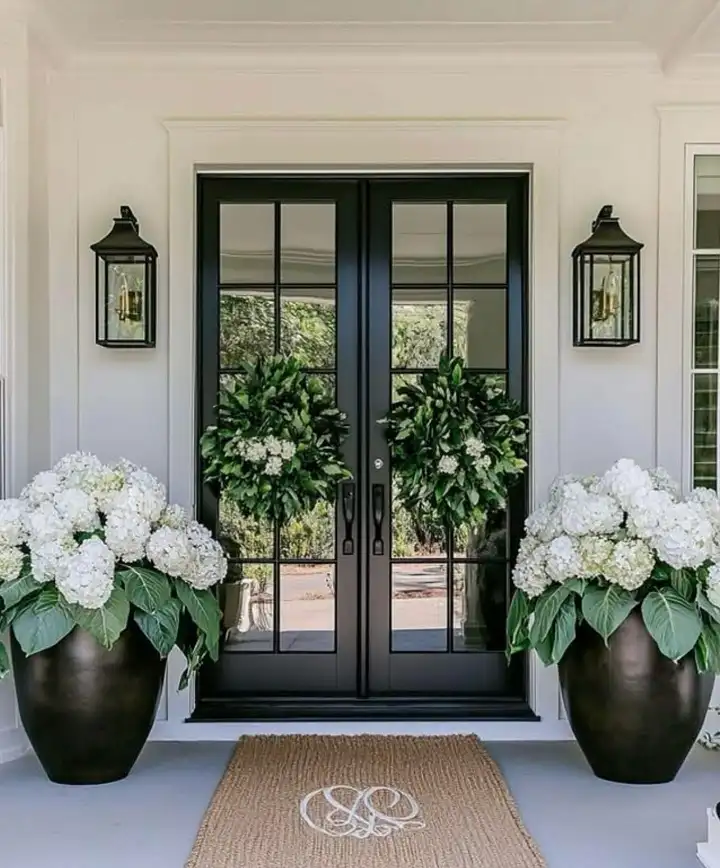 16 Minimalist Front Porch Ideas That Look Expensive on a Budget 12 Oversized Planters Filled With One White Flower