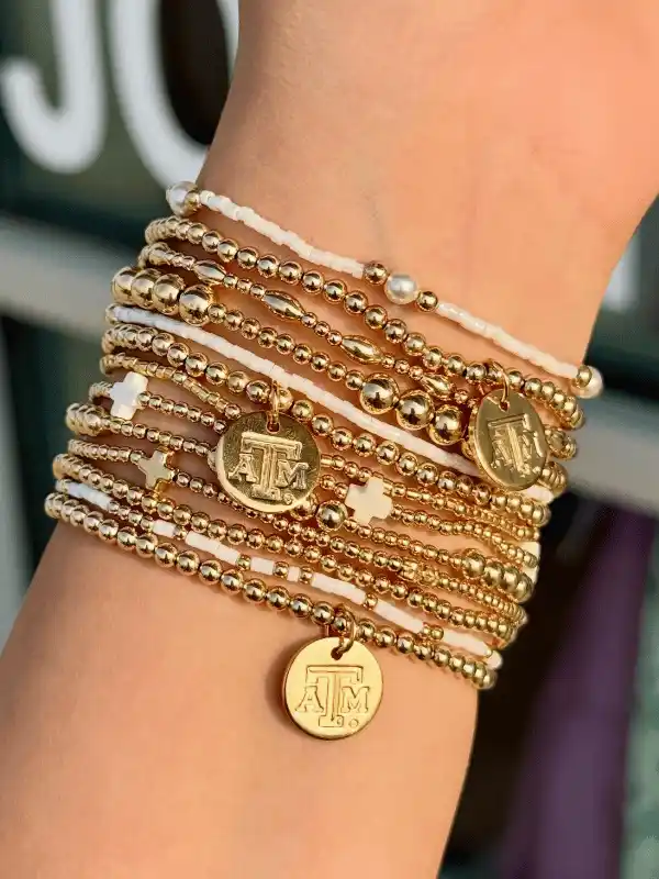 15 Back to School Bracelet Ideas to Trade 4 2. Layered Charm Stacks That Show Off Team Pride