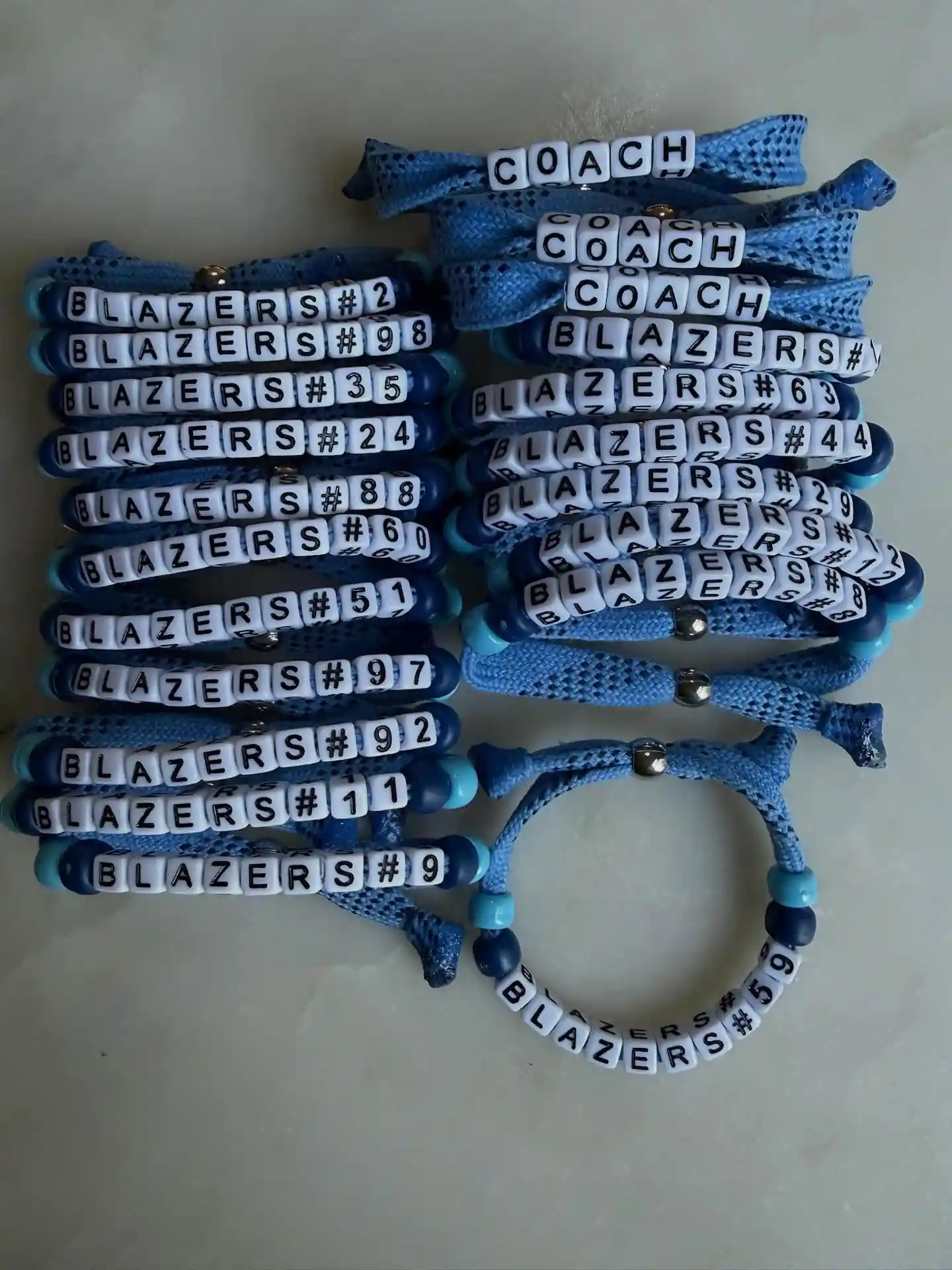 15 Back to School Bracelet Ideas to Trade 10 8. Team Roster Bracelets Made With Braided Shoelace Cord and Jersey Numbers
