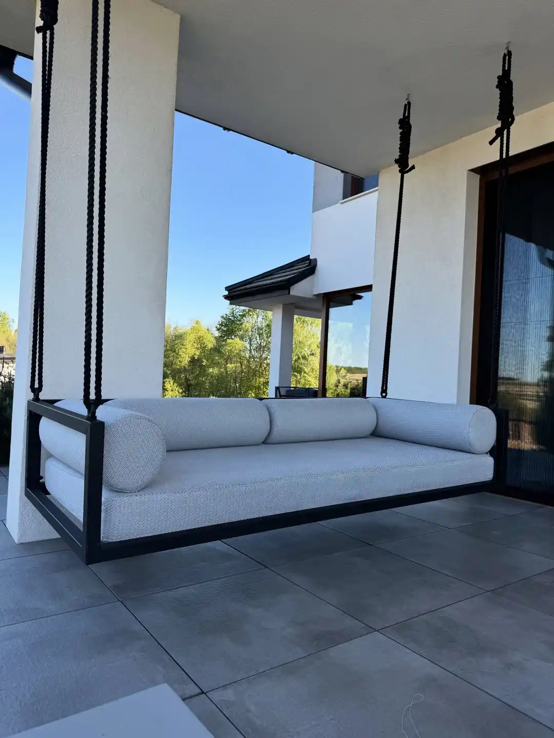 Porch swing with pillows