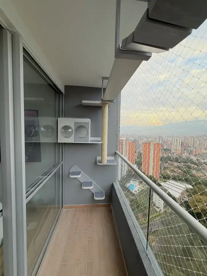 15 Small Balcony Ideas For Pet Owners 2 1. Turn a Balcony Corner Into a Vertical Cat Climbing Wall
