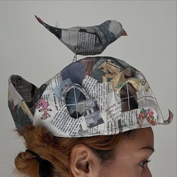 14 Newspaper Craft Ideas for Preschoolers: Roosters, Hats, Tiny Towns and More 12 Folded Newspaper Hat With a Bird on Top