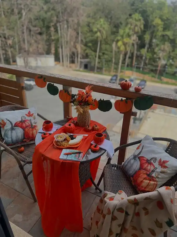 Pumpkin Bistro Table With a Sheer Orange Runner