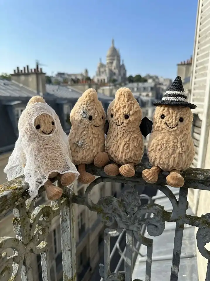 Costumed Plush Peanuts on the Railing